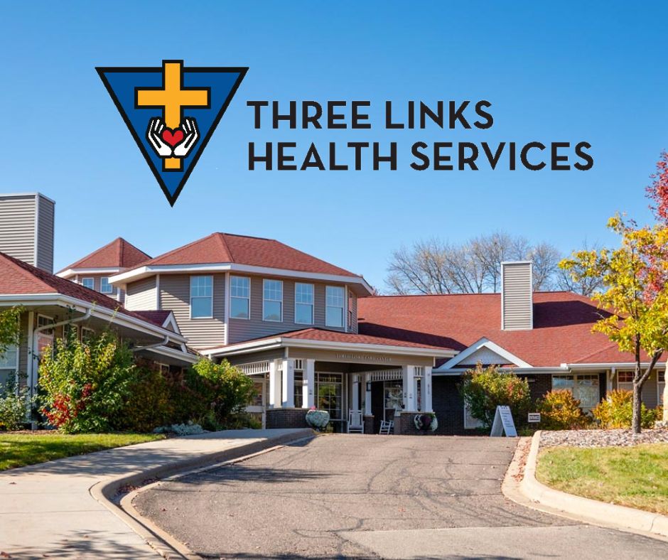 A healthcare facility with a sign reading "Three Links Health Services"—its logo of a cross and hands reflecting compassion—stands under a clear, sunny sky, hinting at its legacy following the merger with St. Francis.
